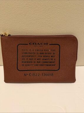COACH Brown Leather Zip Pouch with Printed Storypatch
